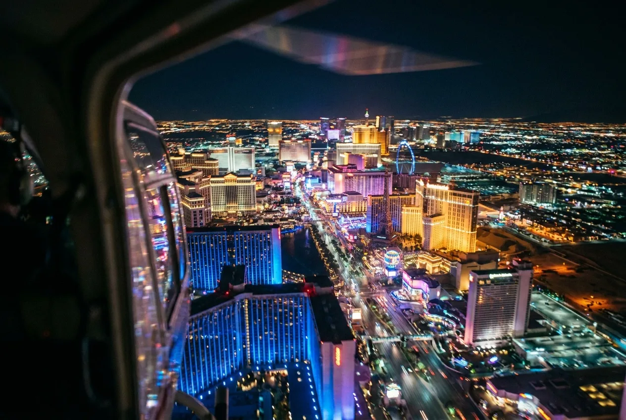 The Las Vegas Strip as a river of neon light at night seen from a helicopter